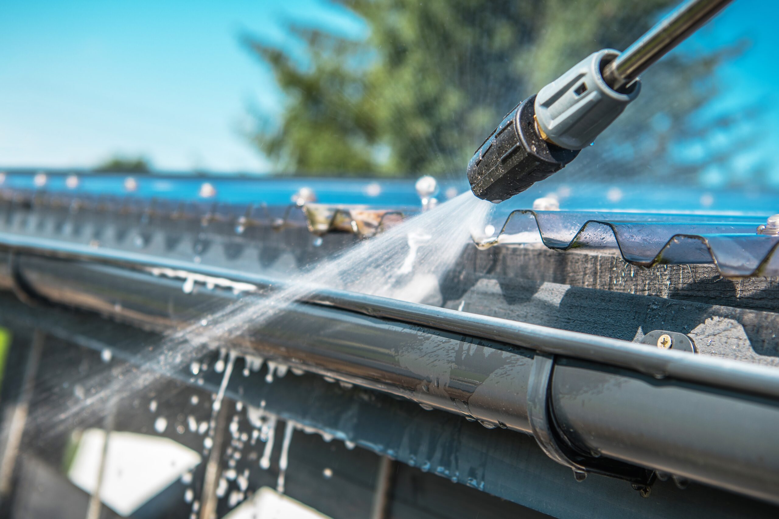 Cleaning gutter to keep from clogging